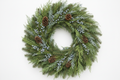 Make the berried juniper smaller and the pinecones in small clusters throughout the wreath